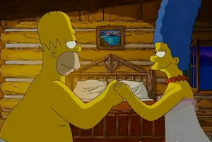 Marge y Homero Simpson en la cabaña del amor